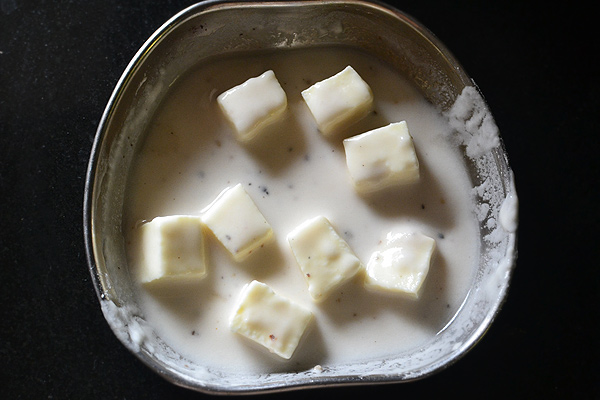paneer cubes are added and coated