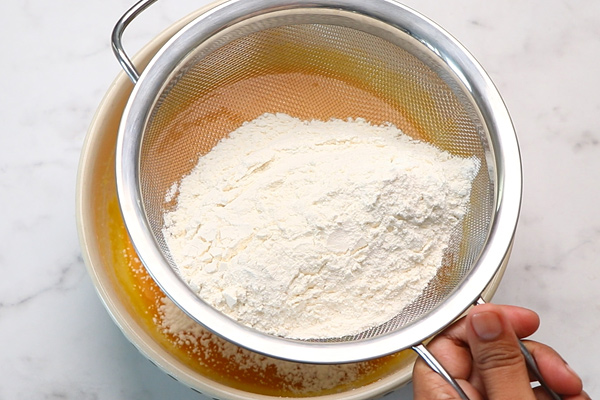 add flour mixture to a sieve