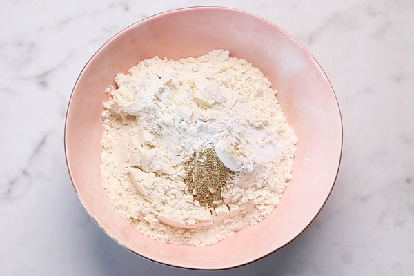 add flour with baking powder, soda and cardamom powder