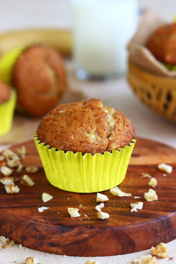 banana muffins served along with a cup of milk
