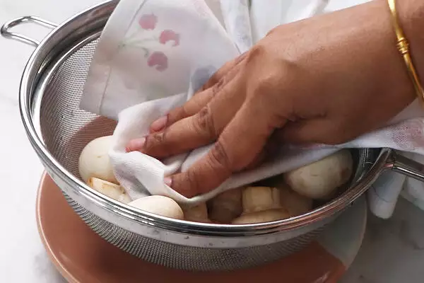 wipe mushrooms with kitchen towel