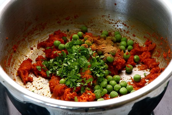 add spice powder, peas, mint, coriander leaves