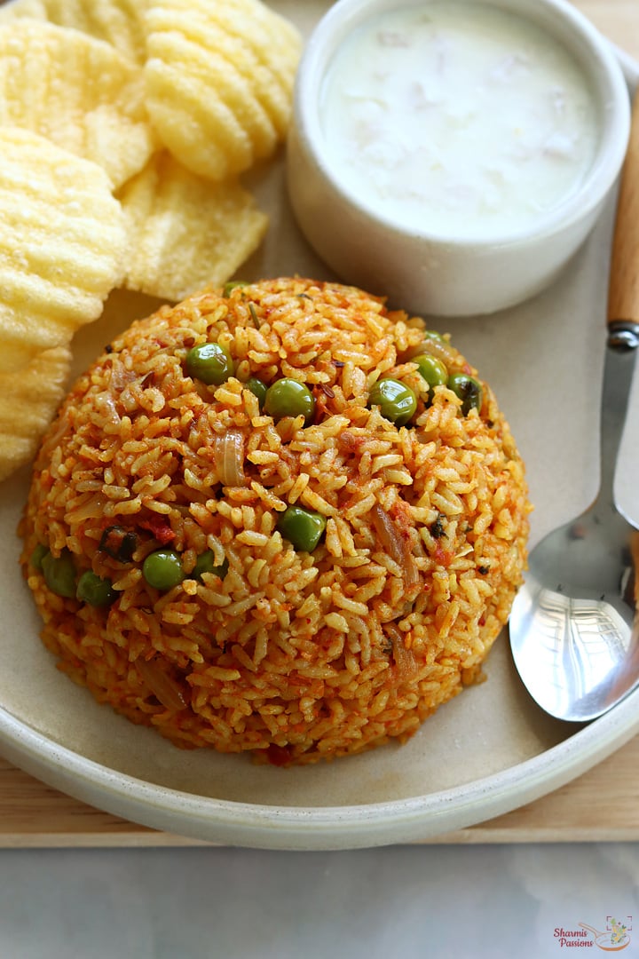 tomato bath served with onion raita, papad
