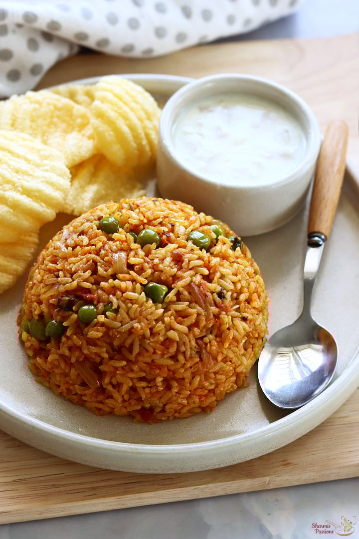tomato bath served with raita and papad