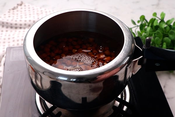 add to cooker with salt, water