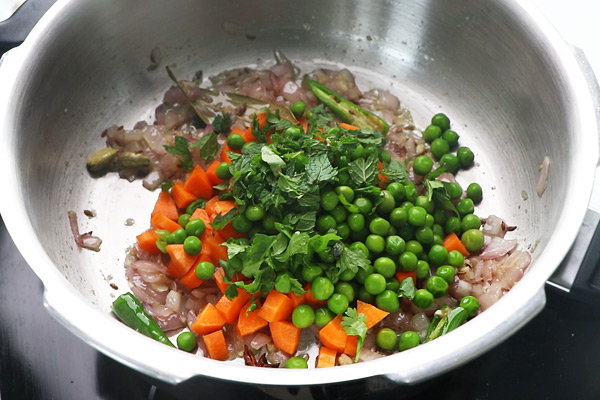 add carrot, peas and herbs