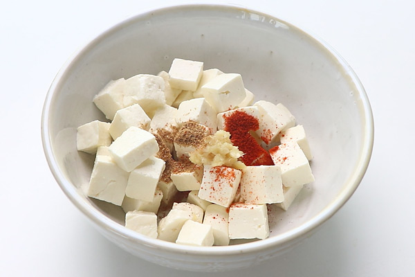 add spice powders to paneer