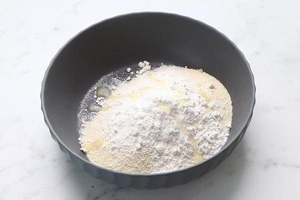 add flour, sooji, oil, soda