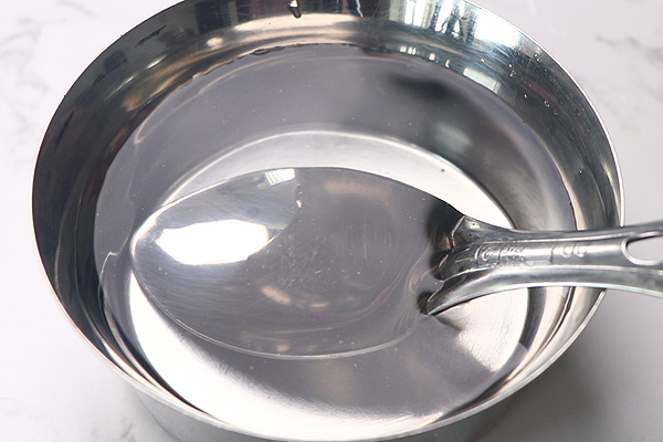 dip ladle in water
