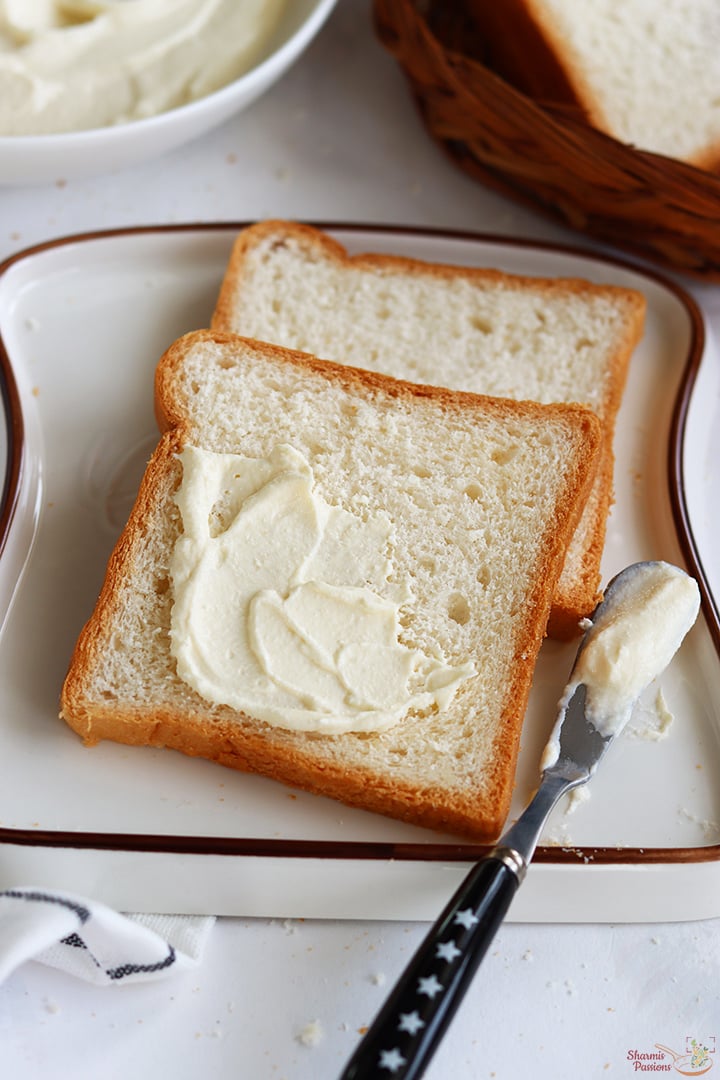 Spread cream cheese on bread