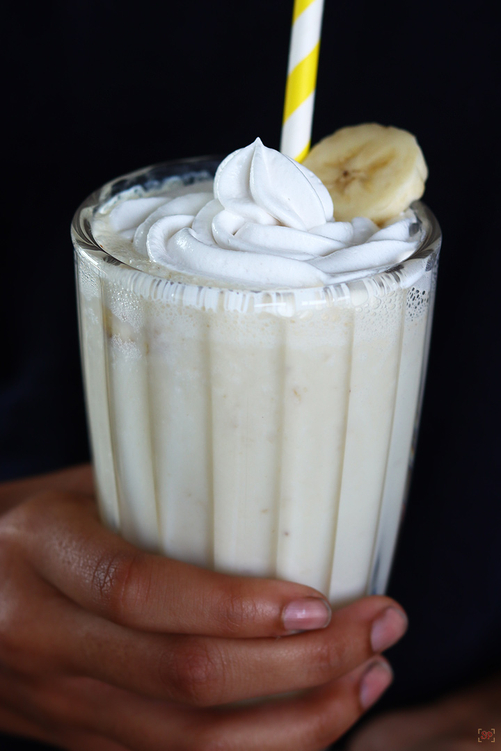 banana milkshake served in a tall glass