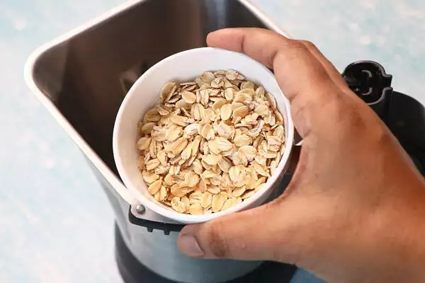 add rolled oats to a mixer jar