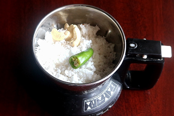 coconut, cashews,salt, green chillies and water are added to a mixer jar