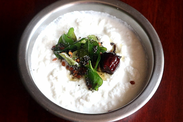 tempering is added to chutney in a bowl