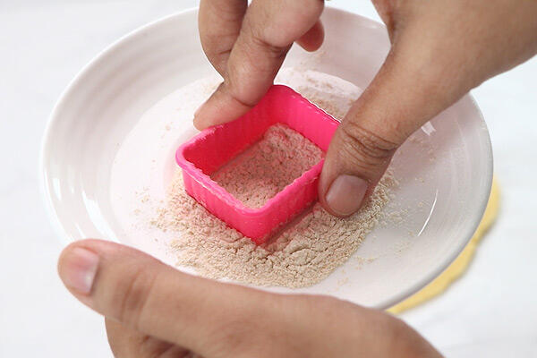 dip cookie cutter in flour