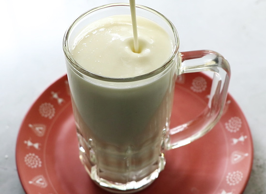 sweet lassi poured into serving glass