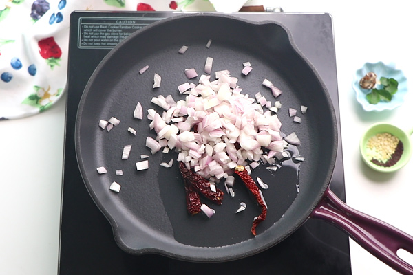 add onion and red chillies to a fry pan