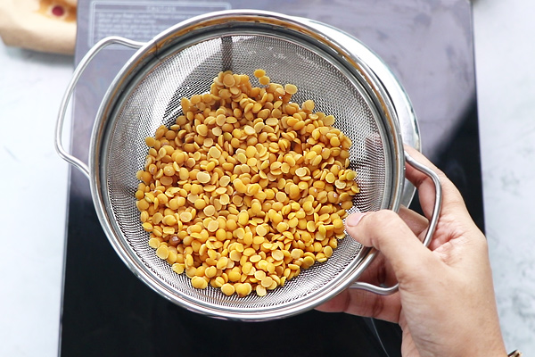 rinse dal well and add to pressure cooker
