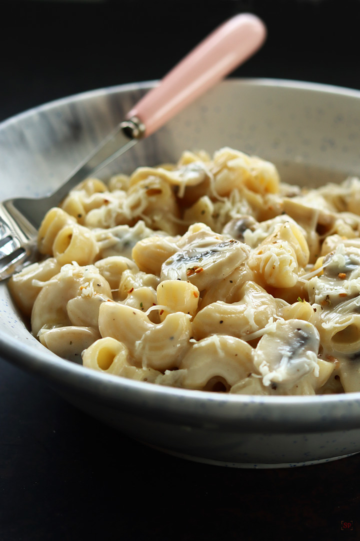 mushroom pasta served with grated cheese