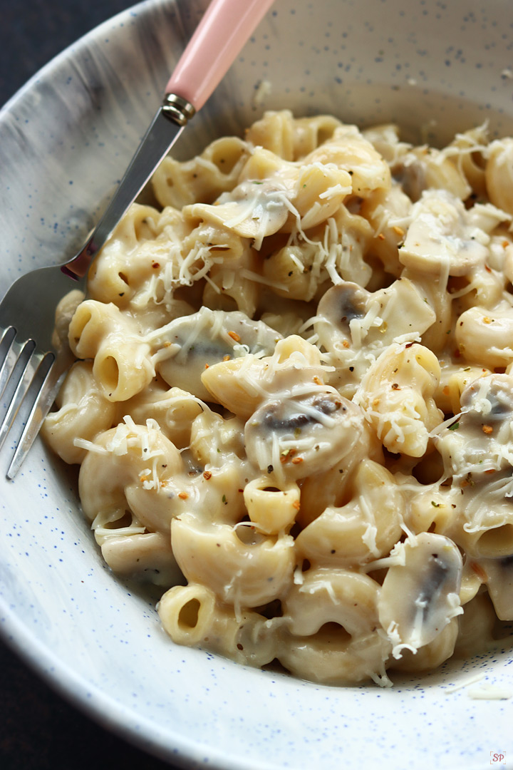 mushroom pasta served with grated cheese