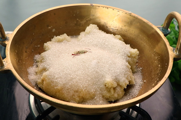 add sugar, cardamom powder and saffron