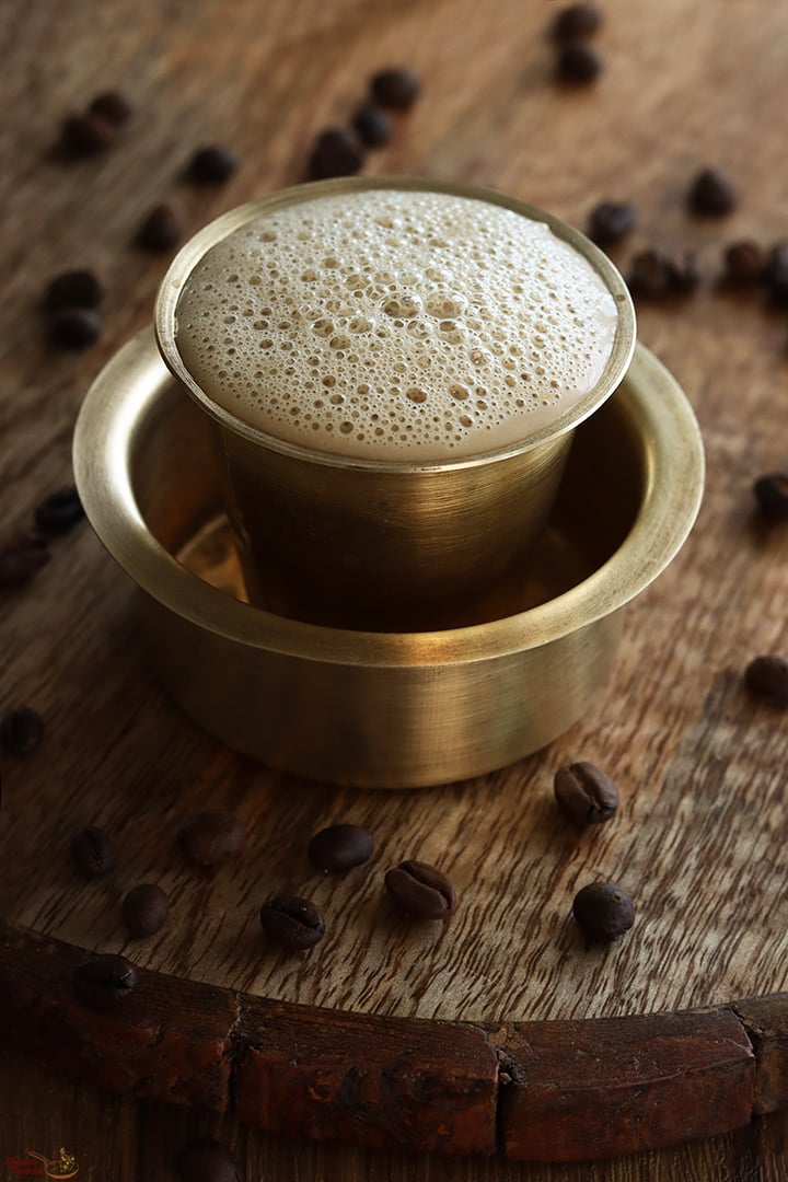 karupatti coffee served in brass davara tumbler