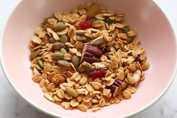 add granola to a serving bowl