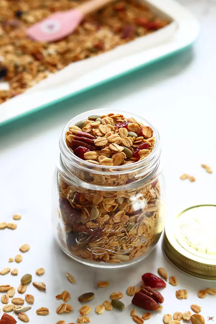 homemade granola baked and stored in a glass jar