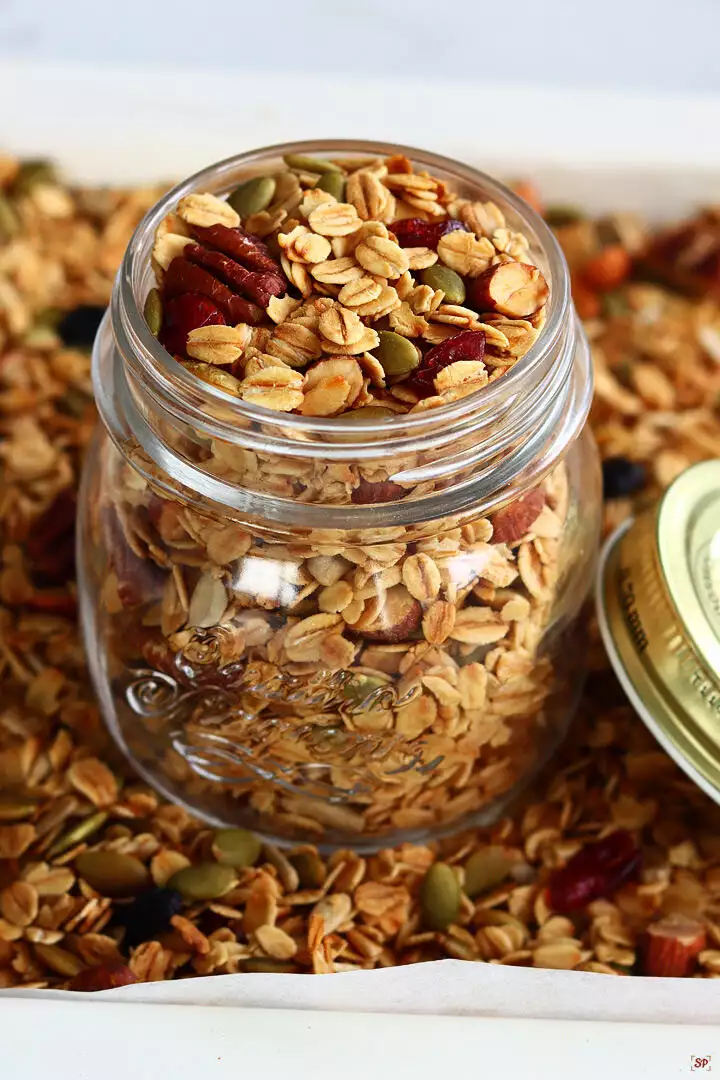 homemade granola baked and stored in a glass jar