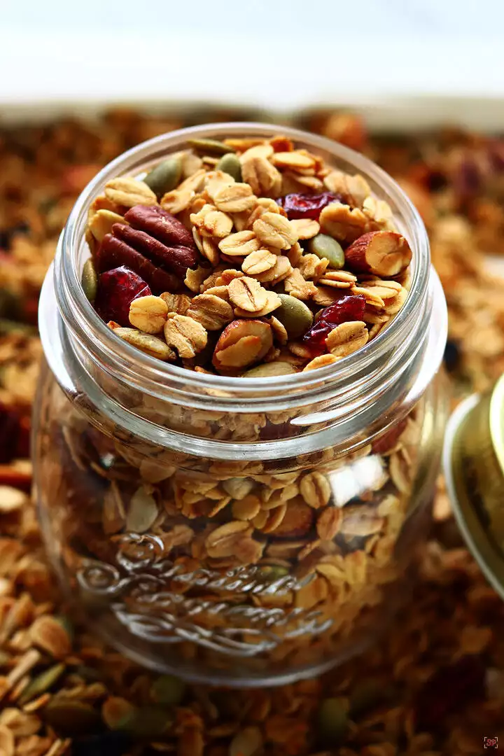 homemade granola baked and stored in a glass jar