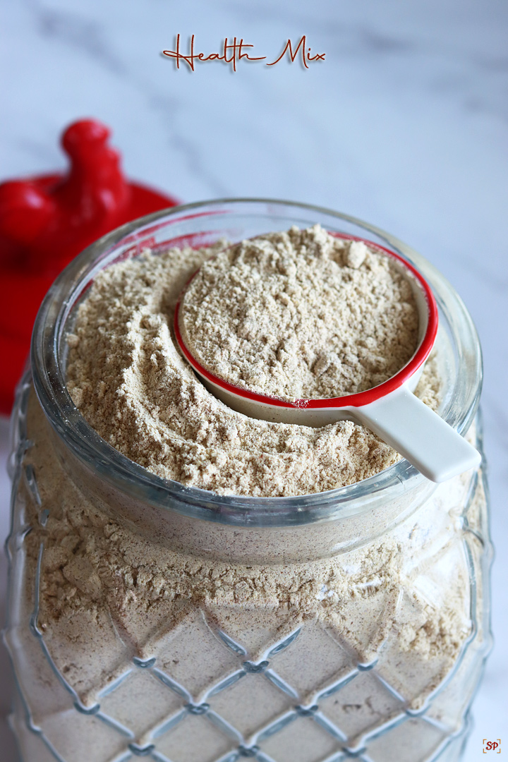 health mix in a glass jar with a red rooster lid