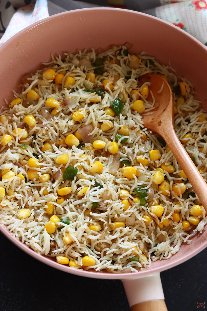 sweet corn rice cooked in a wok