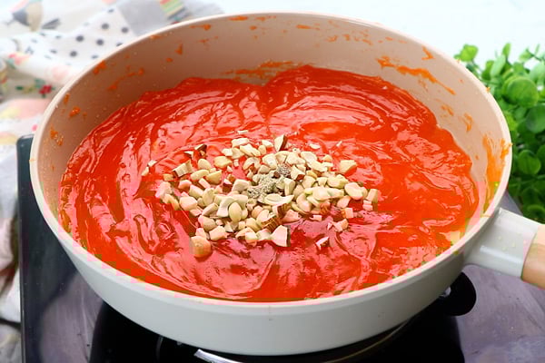 add cashews, almonds, cardamom powder