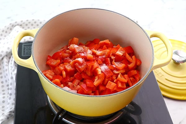 add tomatoes, red capsicum, salt