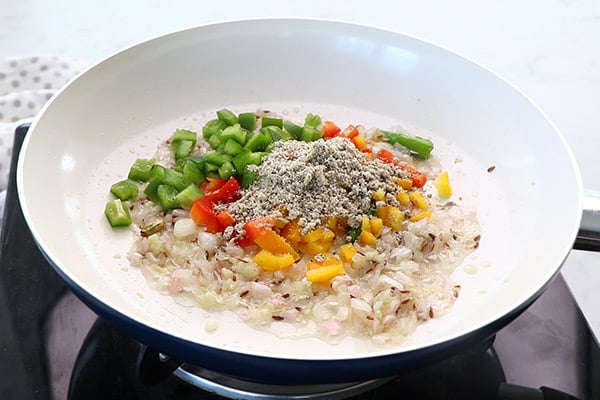 add capsicum, cashew pepper powder