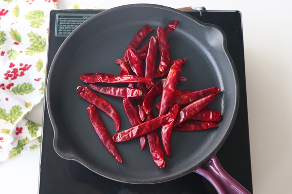 add red chillies to a skillet