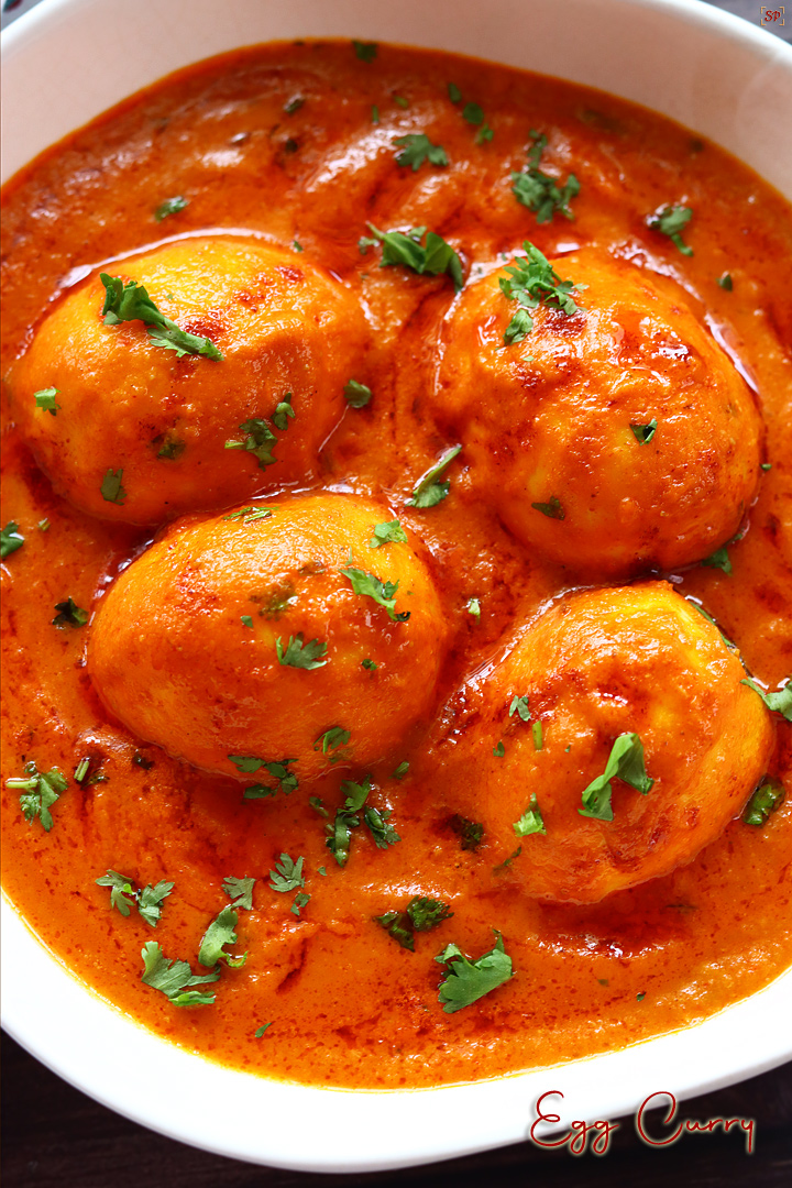 egg curry served in a white bowl