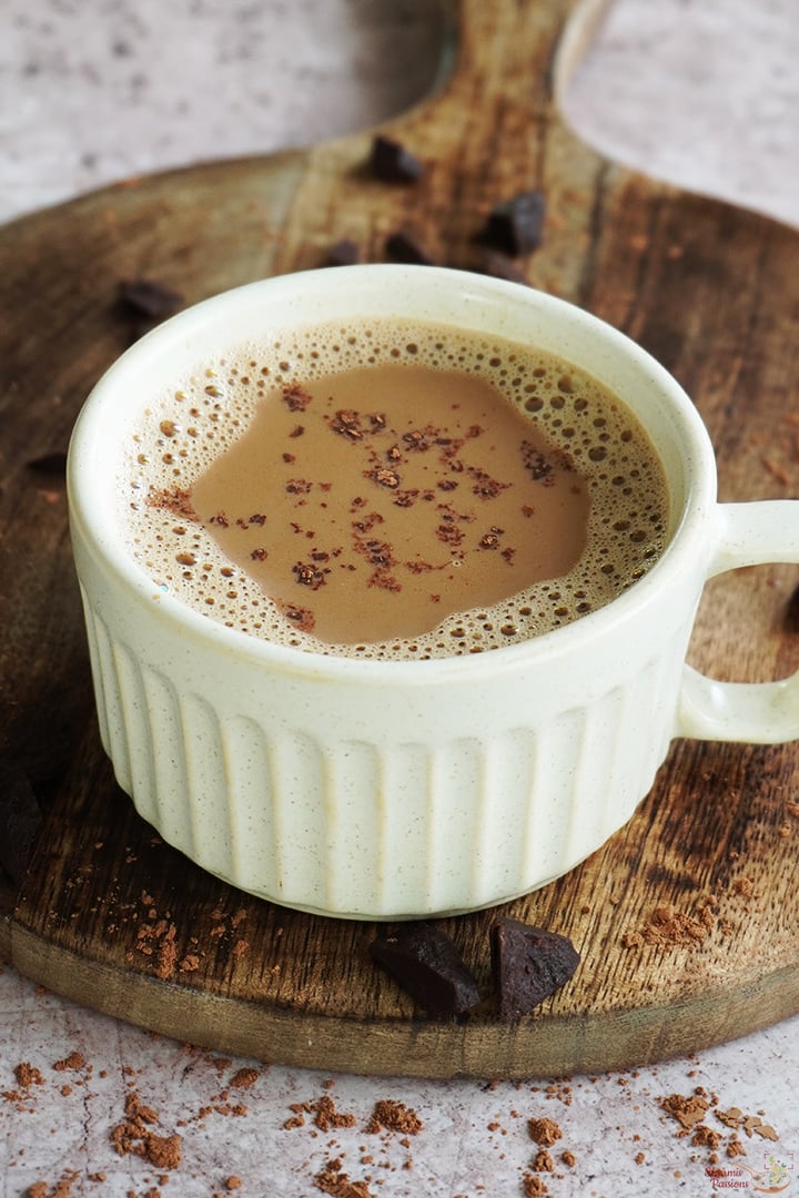 chocolate tea served with a sprinkle of cocoa powder