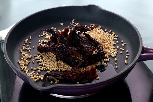 add urad dal, red chilies