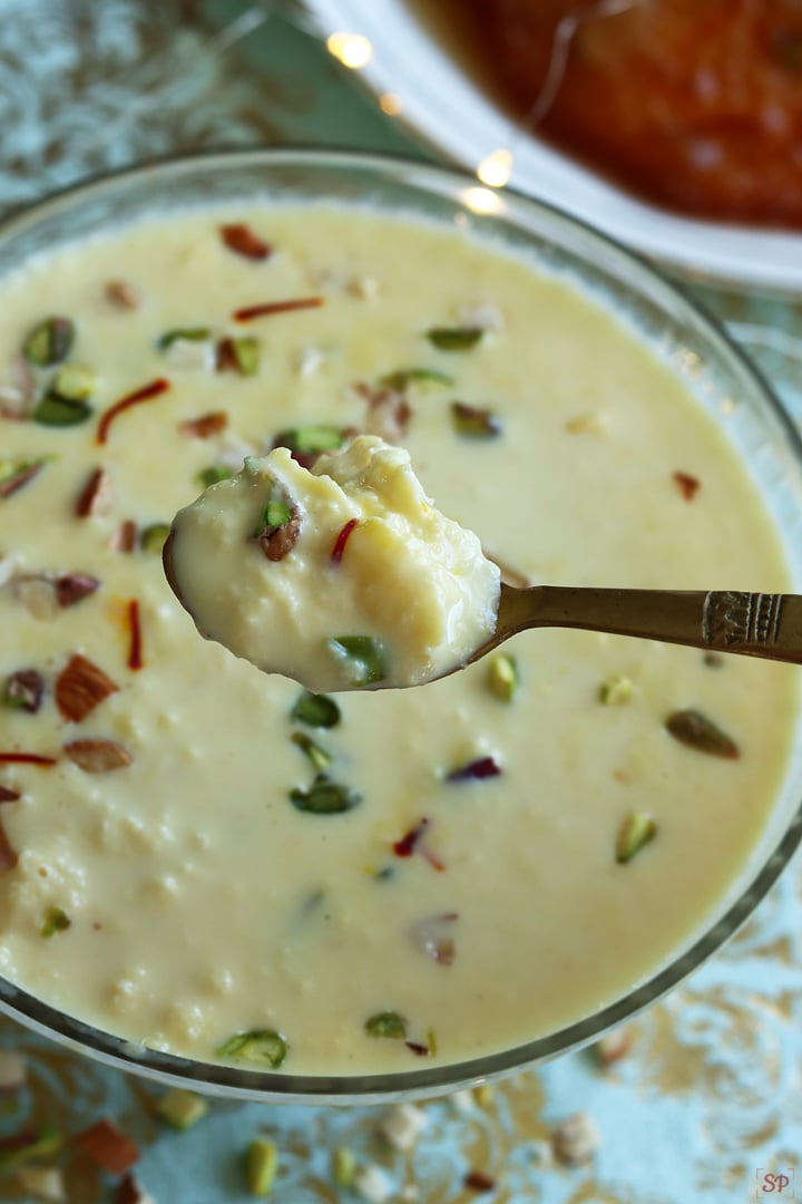 rabri in spoon with malpua