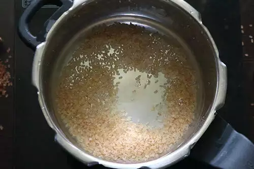 add rice to pressure cooker along with water