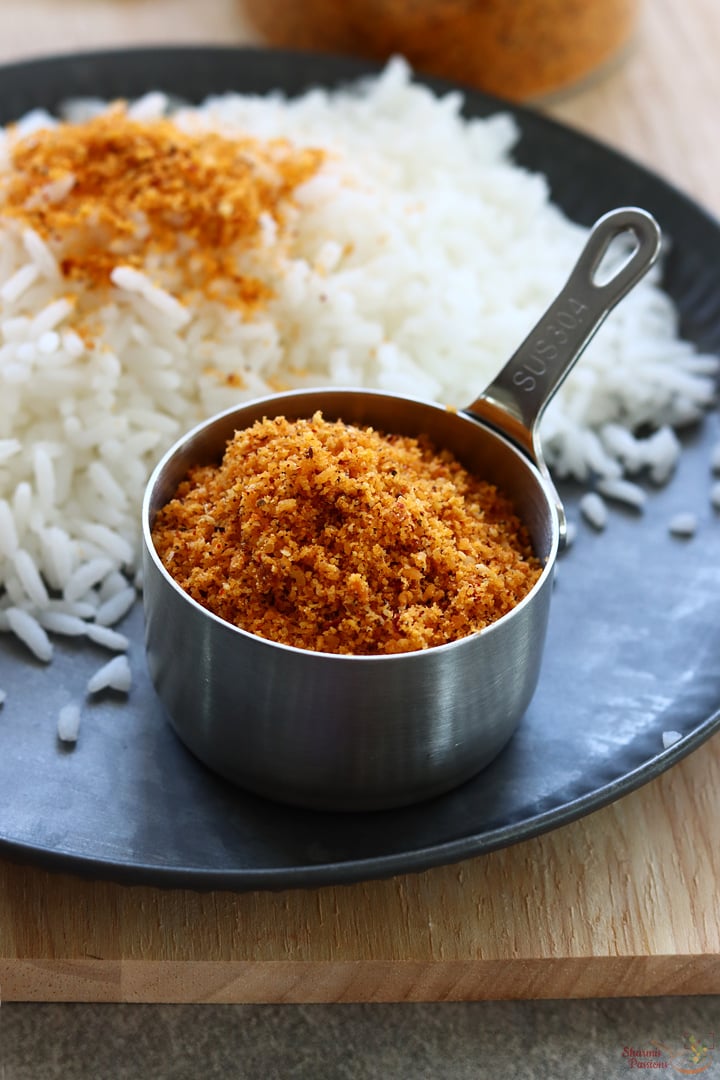 thengai podi in a small bowl with rice