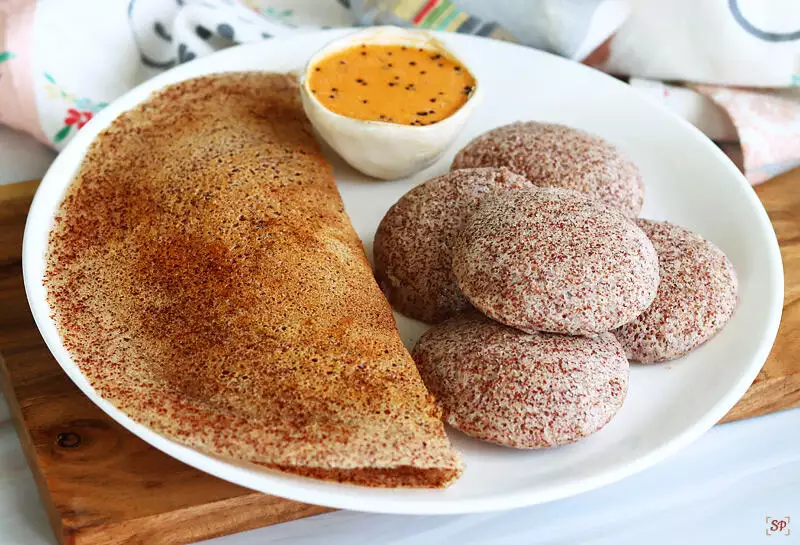 ragi idli and dosa served in a plate with chutney