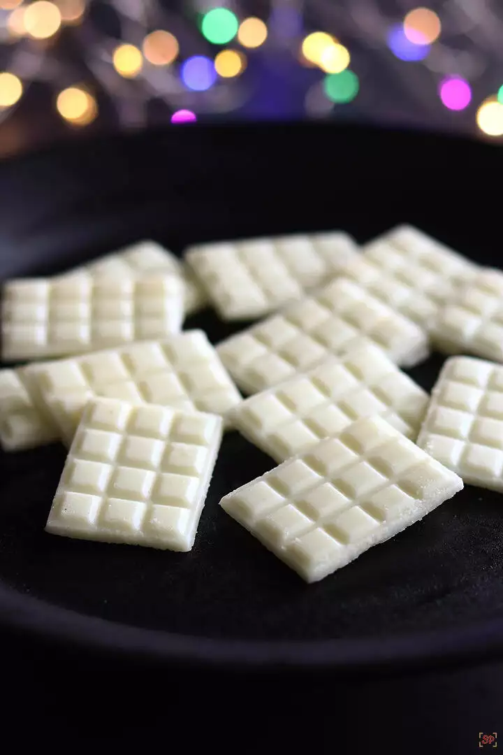white chocolate placed on a black plate