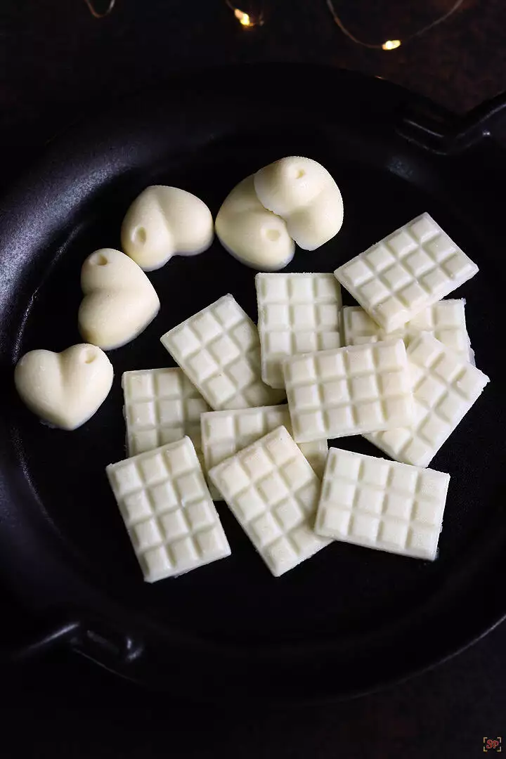 white chocolate placed on a black plate