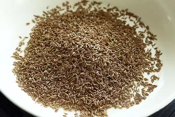 add cumin seeds to a pan