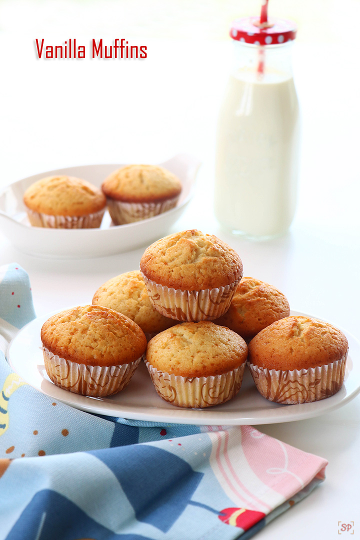 vanilla muffins placed in a plate with milk on the side