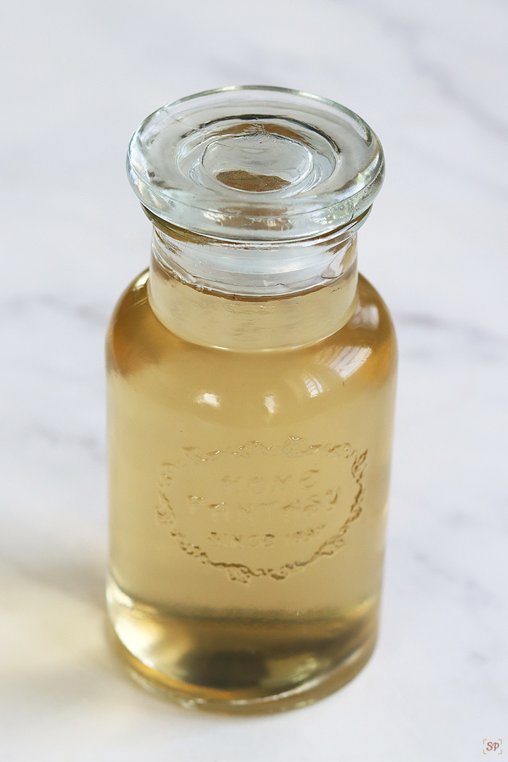 simple syrup in a glass bottle