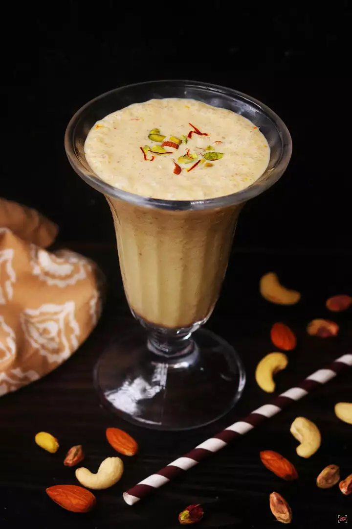 dry fruits milkshake served in a glass cup