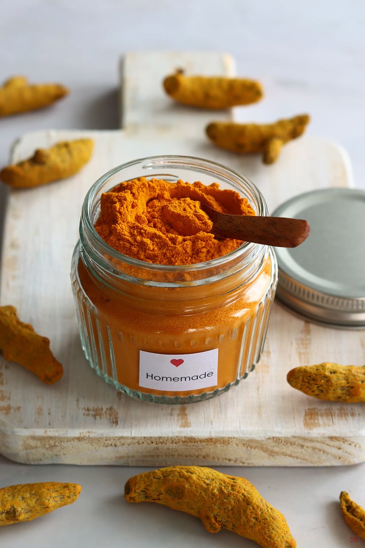 homemade turmeric powder stored in a glass jar